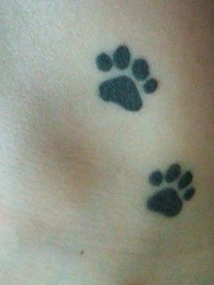 These cute little paw prints are on the inside of my right ankle. Each paw print is about 1 cm big.