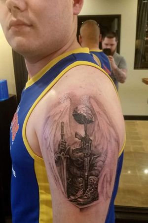 Solider's Battle-cross and Saint Michael. Honoring those who have given everything to defend this great country. Artist was: Vyacheslav "Slava" Bodrov #blackandgreytattoo #realism #battlecross #saintmichael #neverforget #soldier #militarytattoos 