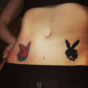 Playboy bunny on right hip, skull bunny on left hip. 