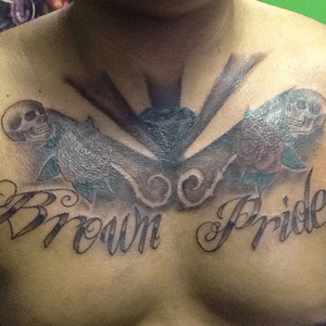 Chest tattoo made at Aztla Ink #aztlaink #chest #skull #roses #brownpride #traditional