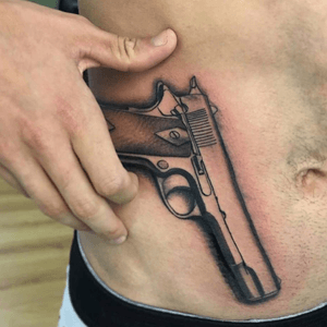Gun black and grey tattoo at Family Art Tattoo #gun #blackandgrey #shadow 