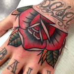 Traditional rose hand tattoo by guest artist gerfer_tattoo #rose #traditional #handtattoo 