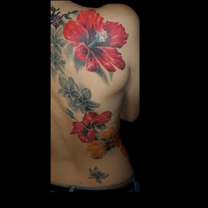 Beautiful flower back piece #flower #floral #redflower #backtattoo