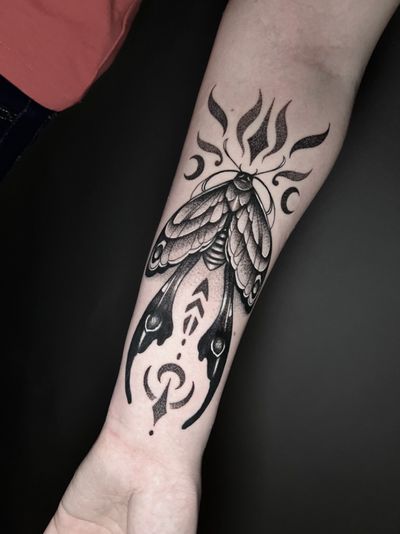 Embrace the dark beauty of a blackwork moth tattoo, expertly crafted by Hamid in a stunning dotwork style.