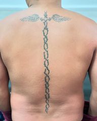 Thorn Sword and Wings Tattoo