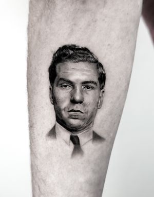 Get inked with a badass black and gray portrait of the iconic mobster Lucky Luciano by Jay Soze. Show off your gangster style!