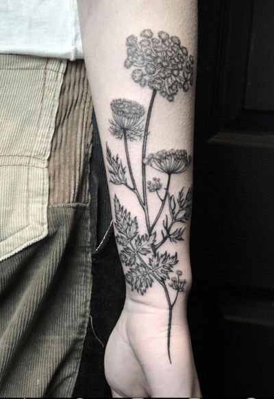 Illustrative tattoo featuring a beautiful tree, flower, and branch design by Amandine Canata.