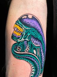 Vibrant Alien Head Tattoo