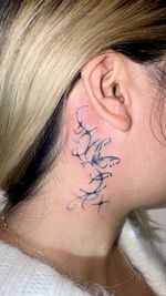 Y2K butterfly and star neck tattoo