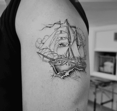 Get a stunning black and gray caravel ship tattoo by the talented artist Georgina. Perfect for sea lovers!