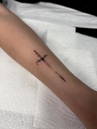 Minimalist Sword Tattoo