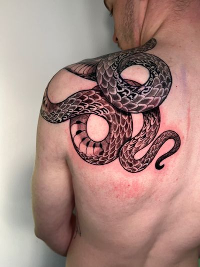 Embrace the dark beauty with this illustrative serpent design by Daniel Ramos. Perfect for those seeking a bold and fierce tattoo statement.