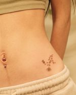 Delicate ornamental vintage flower decorating a hip bone