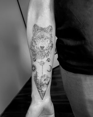 Black and gray geometric tattoo of a wolf in a scenic mountain landscape, by Alfonso Barberio.