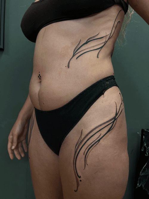 Abstract Flowing Lines Body Tattoo