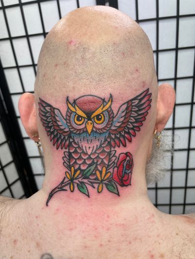 Get a stunning traditional owl tattoo crafted by renowned artist Marc 'Cappi' Caplen. Embrace the wisdom and mystique of the owl with this timeless design.