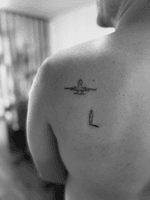 Airplane and Figure Tattoo