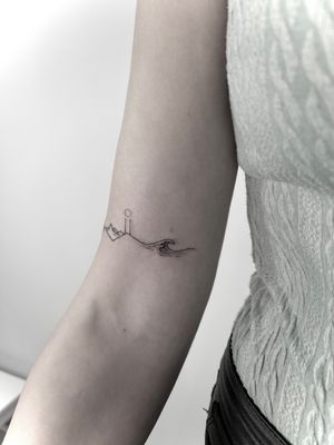 Experience the beauty of nature with this fine line, geometric tattoo by Alina Amberland. Perfect for those who love delicate and intricate designs.