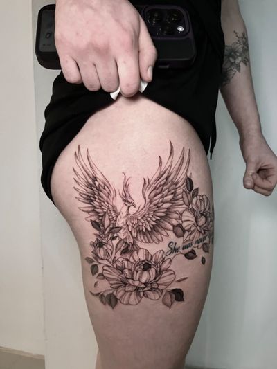 Beautiful floral design featuring a majestic phoenix, expertly crafted by the talented artist Lauren.