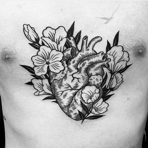 Heart and flowers by Graham Chaffee #hearttattoo #flowerstattoo #heart #flowers #anatomicalhearttattoo #purplepanthertattoo #latattooartist #latattoo #anatomicalheart