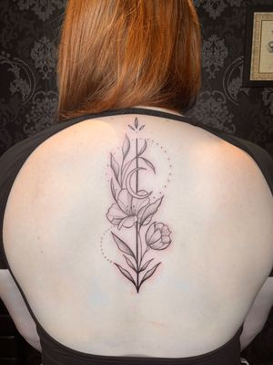 Feminine spine floral tattoo 