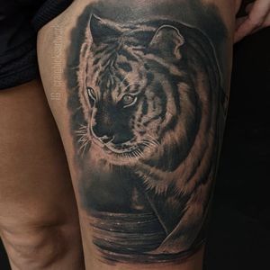 Experience the power and beauty of a fierce tiger brought to life in stunning black and gray realism by tattoo artist Craig Hicks.