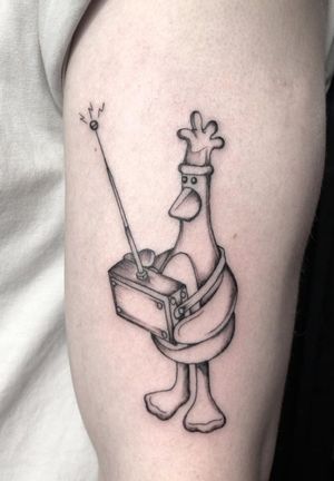 Illustrative black and gray tattoo featuring Feathers McGraw from Wallace and Gromit, crafted by talented artist Amandine Canata.