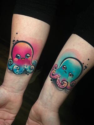 Express your love for marine life with a vibrant watercolor tattoo featuring an octopus, sea turtle, happy, and angry expressions by Cloto.tattoos.