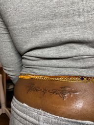 Neotribal Lower Back Tattoo
