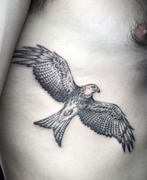 Get inked with a stunning black and gray illustration of a powerful bird of prey, crafted by the talented artist Amandine Canata.