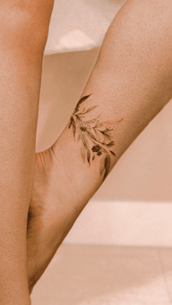 Fine line floral anklet with honeysuckle, bluebells, daisies and forget-me-not flowers, free-hand design