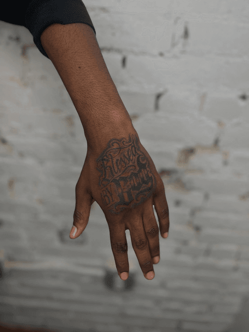 "Blessed By God" Hand Tattoo