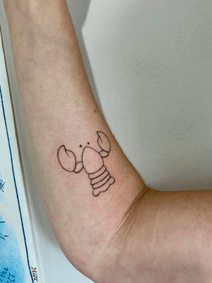 Fine line lobster design in hand-poked style by Charlotte Pokes, with added doodle elements.