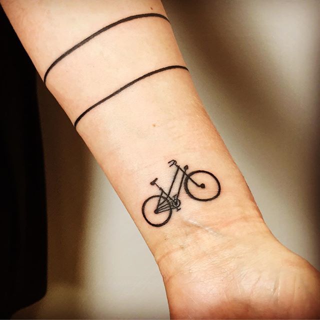 Minimalistic style bicycle tattoo done on the wrist