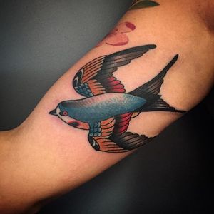 Tattoo by Caitlin Drake McKay. This design from her flash. #Chicago #chicagotattooer #chicagotattooartist #animalfarmtattoo #flash #swallow