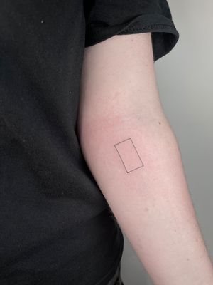 Get inked with a fine line geometric tattoo featuring frames, squares, and rectangles by the talented artist Alina Amberland.