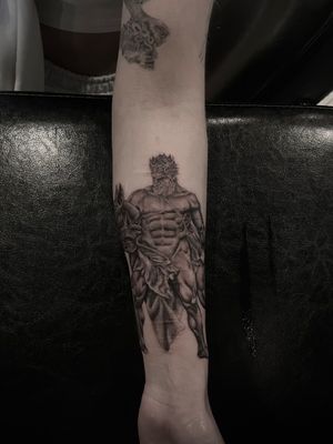Capture the power of Greek mythology with this detailed black and gray tattoo of Hercules, expertly done by Lauren in a stunning illustrative style.