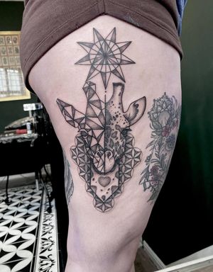Unique blackwork design combining geometric shapes with a heart motif, created by the talented artist Ryan Mckenzie.