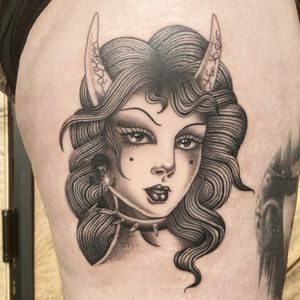 Get inked with Megan Foster's illustrative design showcasing a captivating lady devil motif. Embrace your dark side with this striking tattoo.