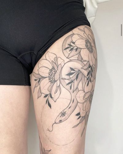 Unique blackwork and dotwork design by Ali Bloom featuring a geometric snake intertwined with a delicate flower motif.