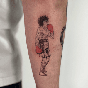 Get inspired by Hajime no Ippo with this epic anime boxer tattoo design by Jo Heatley. Show off your love for boxing with this unique piece.