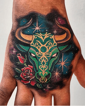 Illustrative watercolor tattoo of a galaxy with Taurus horoscope sign, located in New York, US.