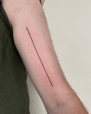 A minimalist tattoo with delicate lines, expertly done by Alice Hope Tattoo, showcasing the beauty of simplicity.