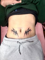 Symmetrical Neotribal Hip Tattoos