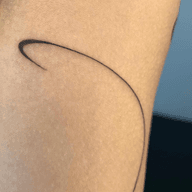 Minimalist Curved Line Tattoo