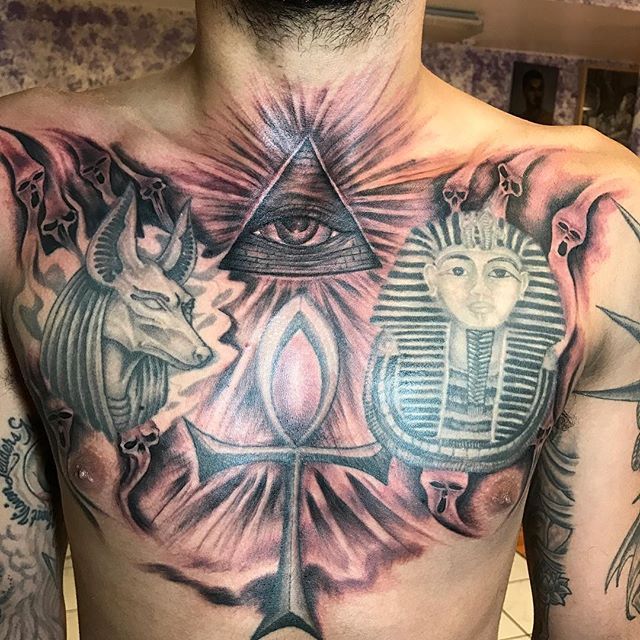 Egyptian Anubis And Ankh Tattoo On Man Chest