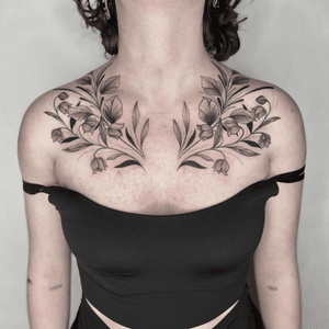 Black and gray fine line floral tattoo by Marissa Boulay featuring a intricate botanical motif.