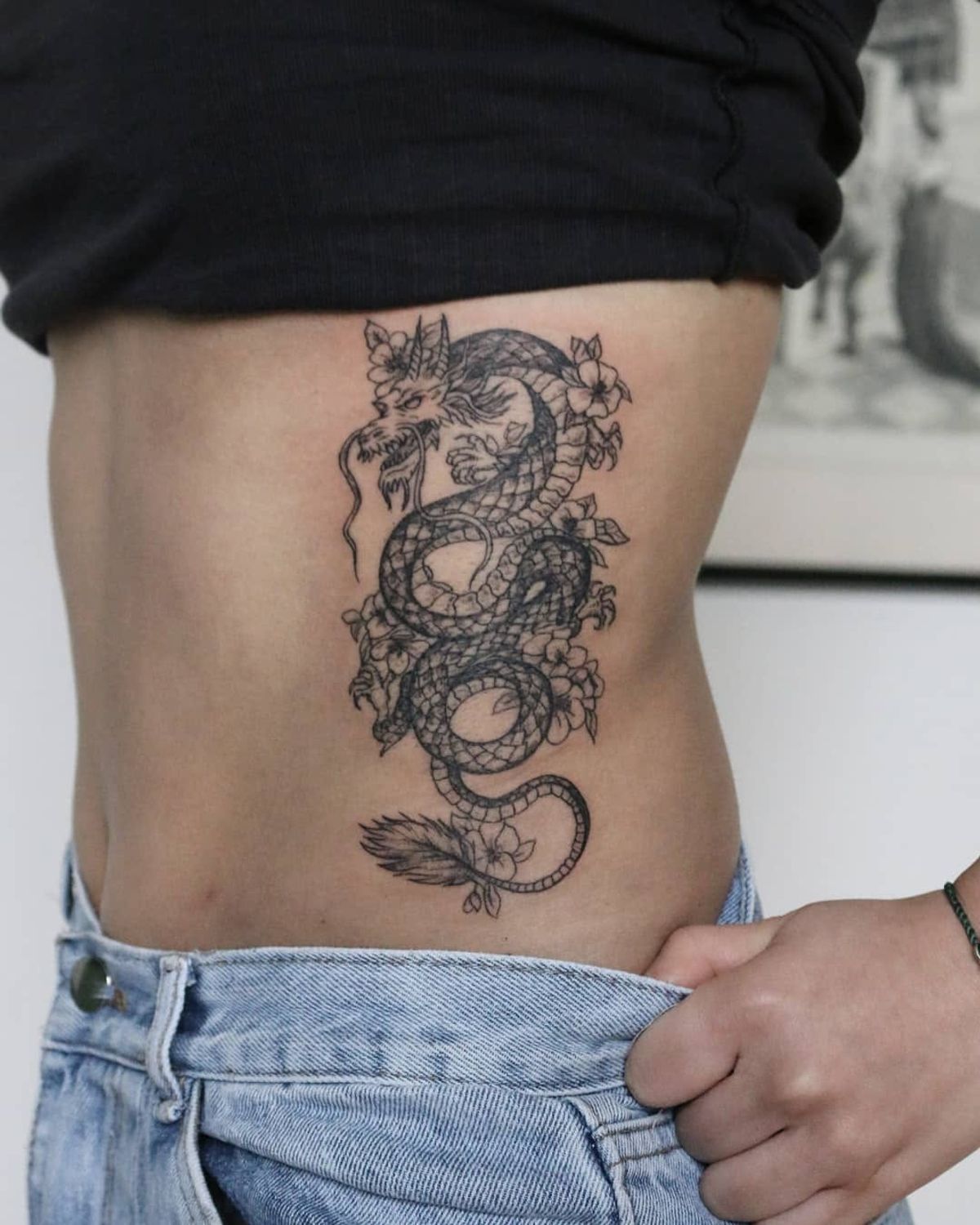 delicate floral collarbone tattoo