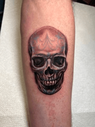 black and grey skull tattoo