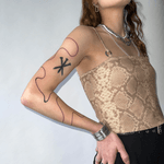 Abstract Symbol and Wavy Arm Tattoo